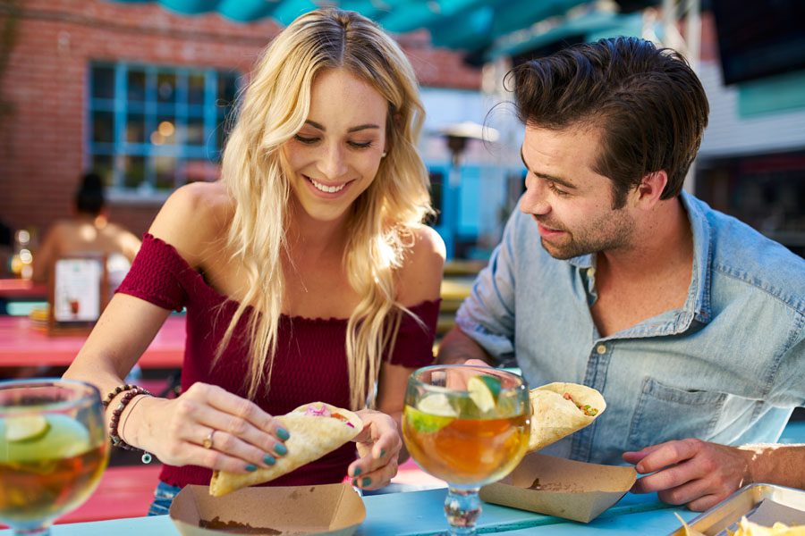 Specialized Business Insurance - Young Couple Out to Eat at a Mexican Restaurant